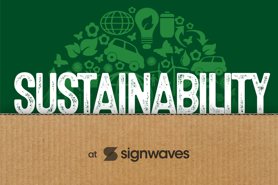 Sustainability at Signwaves wording on a cardboard and green background