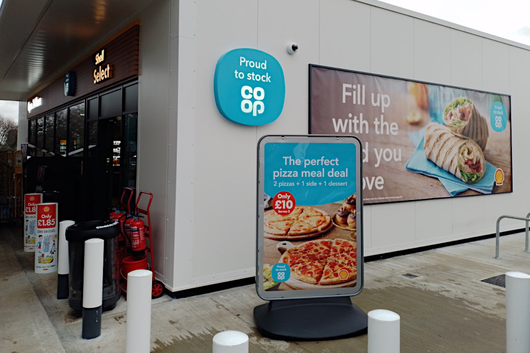 Sentinel pavement sign with Coop branding
