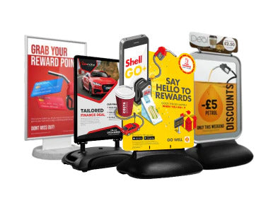 A set of digital signage display stands with multiple sample screens showing advertisements.