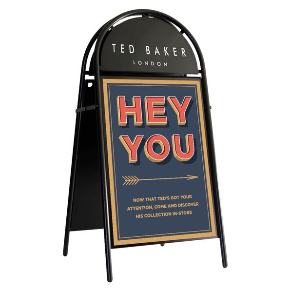 Ted Baker London promotional sign with 'Hey You' text on a white background