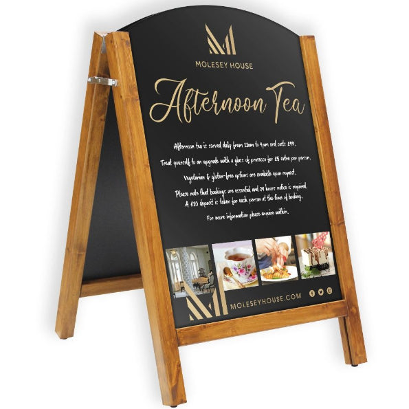 A-frame sign for Molesey House Afternoon Tea with wooden frame and black chalkboard surface.